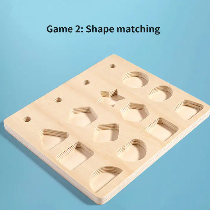 Child playing with wooden shape matching board